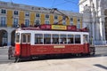 Red tram on a square Praca de Comercio in Lisbon, Portugal